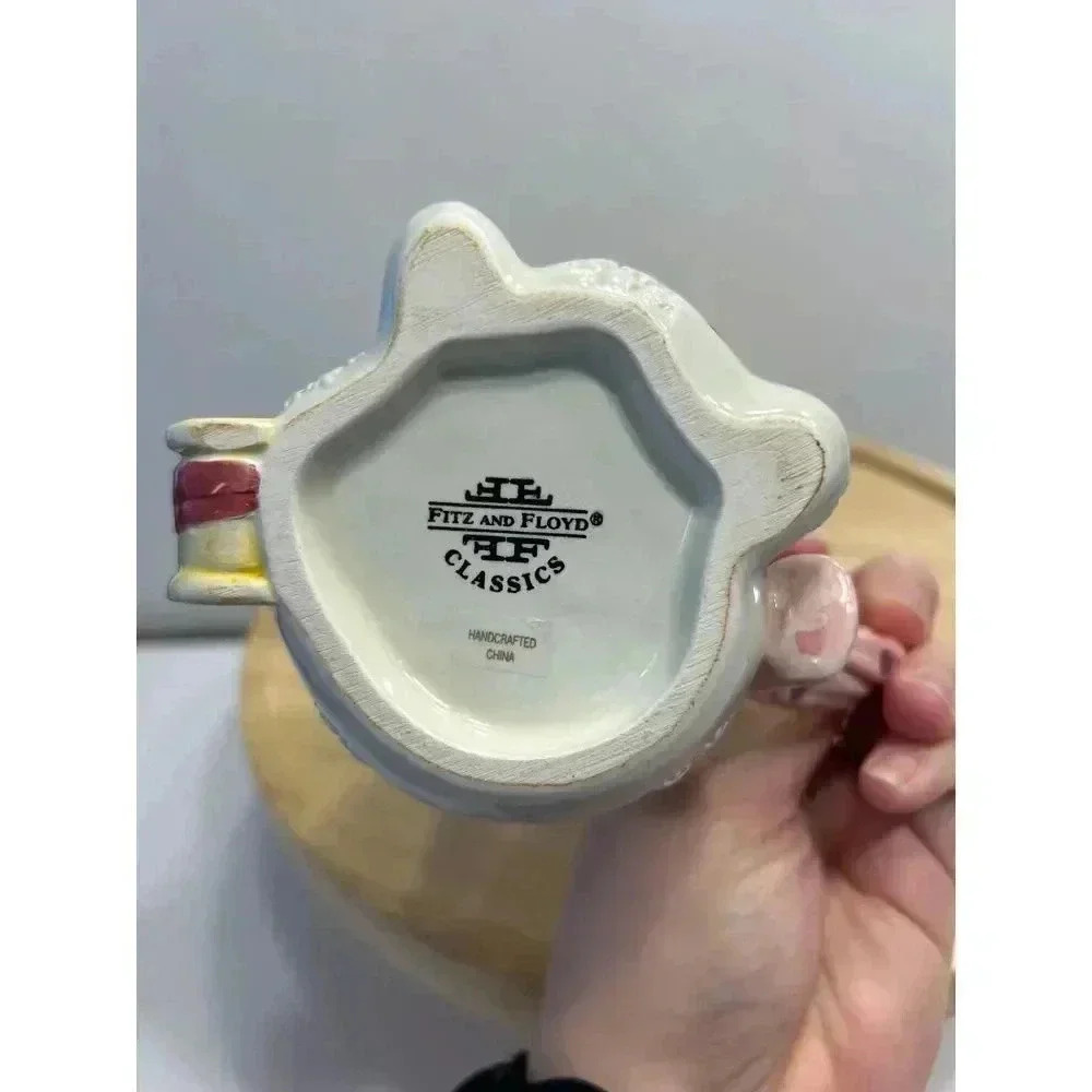 Fitz and Floyd Snowman Creamer from Frosty Folks Collection Holding Gift - Picture 4 of 7